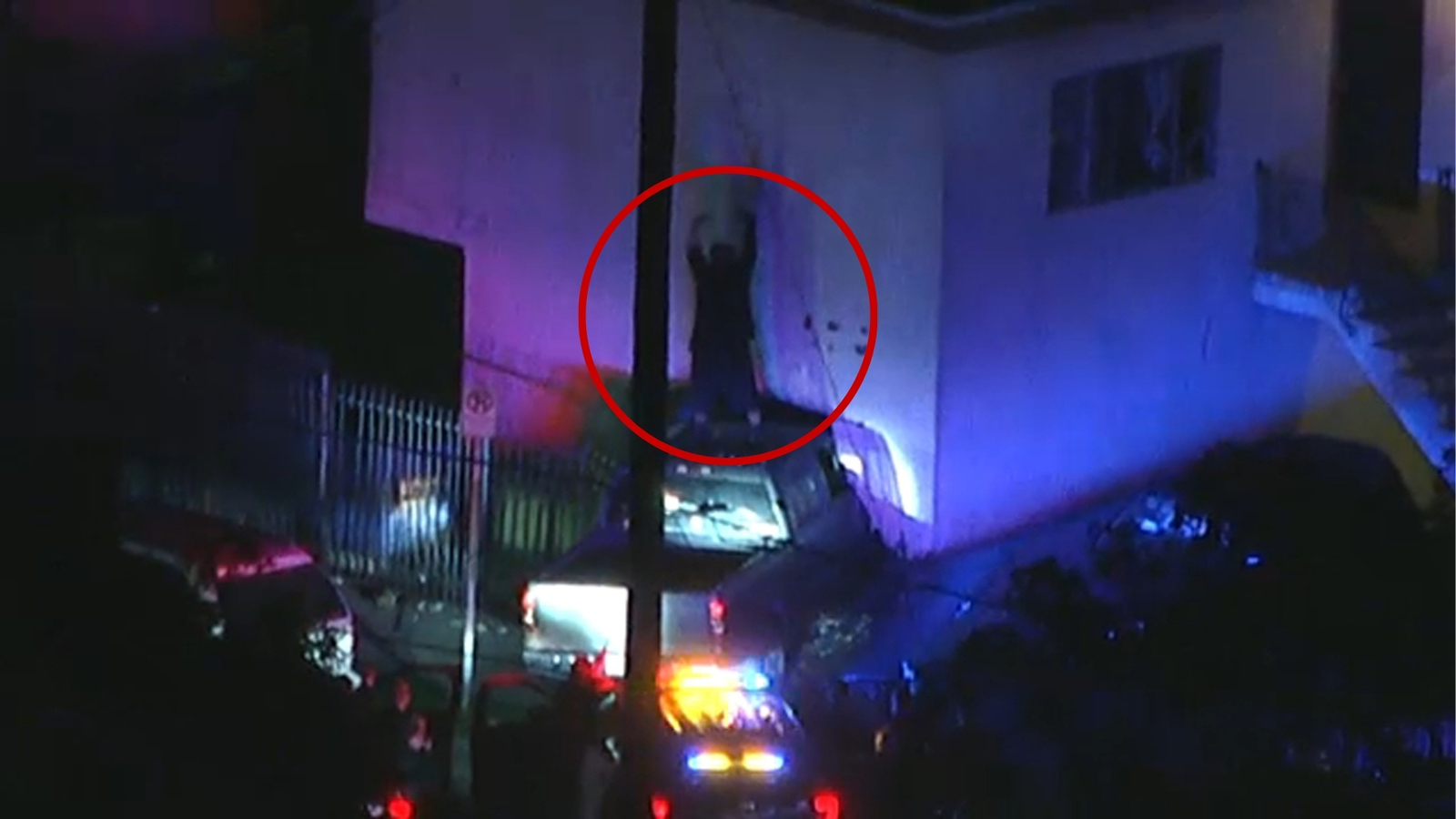 Driver gets on top of pickup truck after police chase ends with crash into South Los Angeles apartment building
