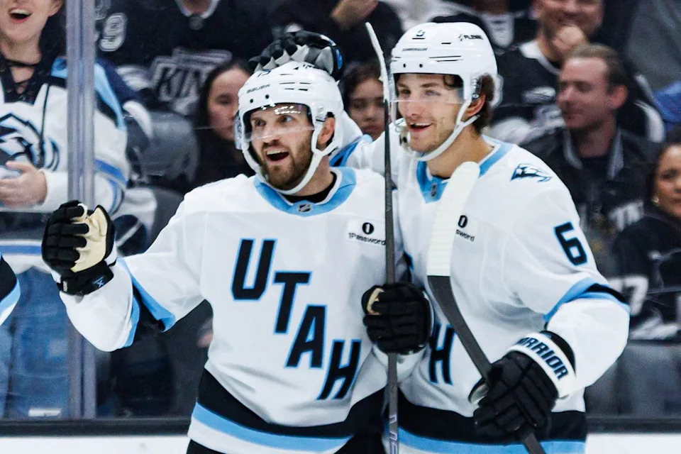 Utah Mammoth center Alexander Kerfoot (#15) celebrates with defenseman John Marino (#6) after scoring a goal during an NHL match against the Los Angeles Kings on March 28, 2026 in Los Angeles, California.