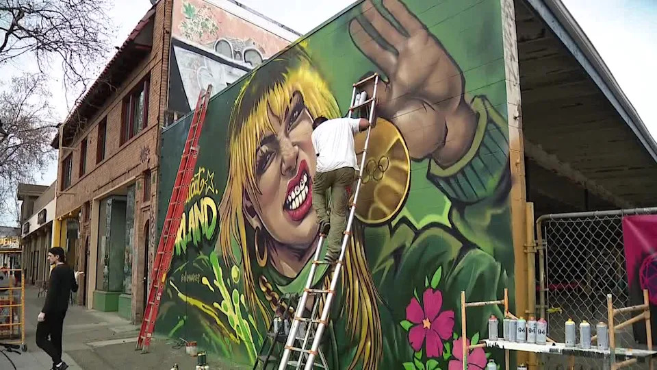 <div>A vibrant new mural of Alyssa Liu is now gracing Oakland in the Temescal district. Reaching 15 feet high, the colorful painting shows off Liu's signature halo hair and sparkling teeth. Feb. 28, 2026</div>
