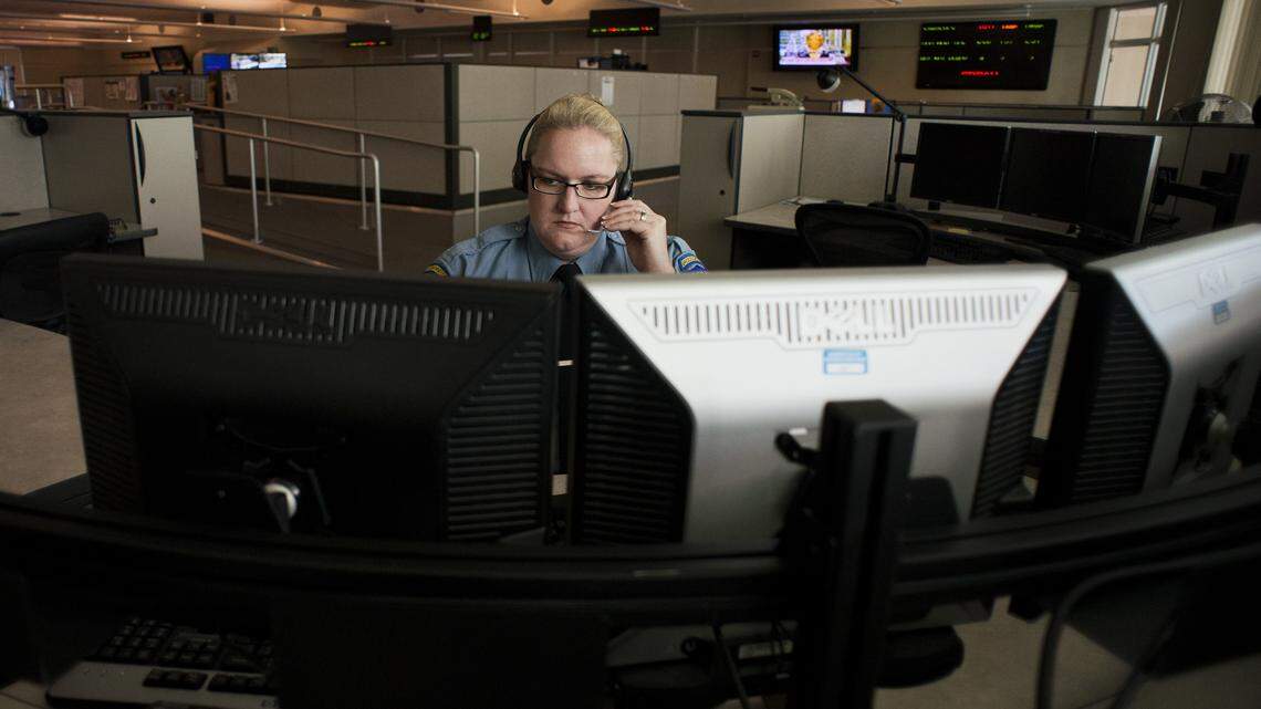 Sacramento Police Dispatcher II Sarah Kern receives emergency calls at Sacramento Police Communication Center in 2013.