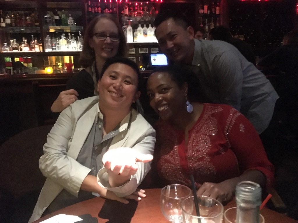 Group of people in a dim room at Taix in Echo Park.