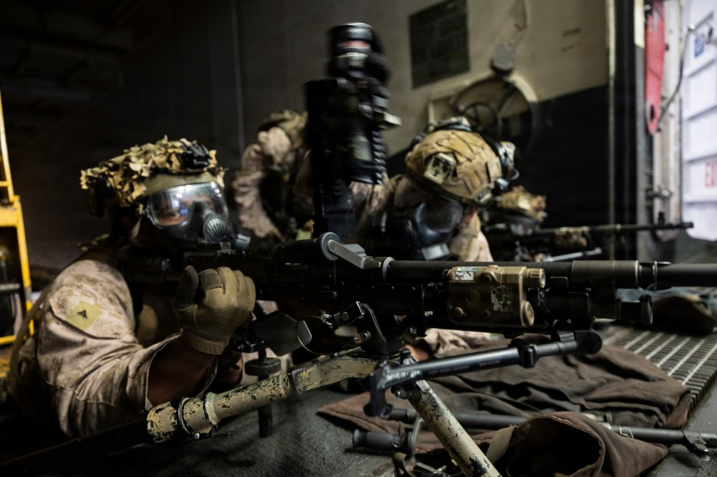 U.S. Marines train with M240B machine guns on the USS Boxer.