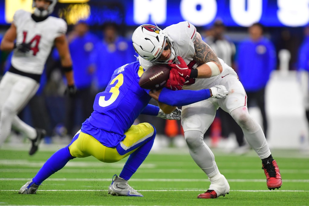Los Angeles Rams safety Kam Curl breaks up a pass to Arizona Cardinals tight end Trey McBride.