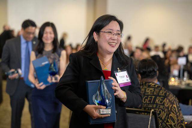 Change Maker Dr. Elisa Tong makes her way toward her table during Change Makers Celebration 2025 on April 4, 2025, at Sacramento State.