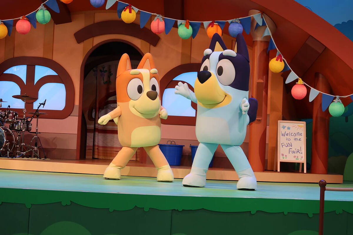 Bingo, left, and Bluey in "Bluey's Best Day Ever!" at the Disneyland Resort, a n ...