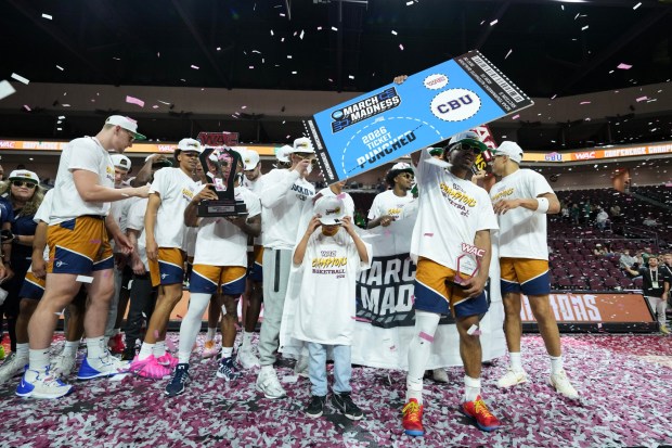 LAS VEGAS, NEVADA - MARCH 14: The California Baptist Lancers celebrate defeating the Utah Valley Wolverines 63-61 the championship game of the Western Athletic Conference men's basketball tournament at the Orleans Arena on March 14, 2026 in Las Vegas, Nevada. (Photo by Candice Ward/Getty Images)