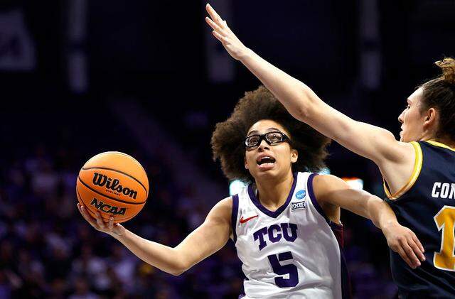 FORT WORTH, TEXAS - MARCH 20: Olivia Miles #5 of the TCU Horned Frogs goes to the basket as Erin Condron #11 of the UC San Diego Tritons defends in the first half against the UC San Diego Tritons during the first round of the NCAA Women's Basketball Tournament on March 20, 2026 in Fort Worth, Texas. (Photo by Ron Jenkins/Getty Images)