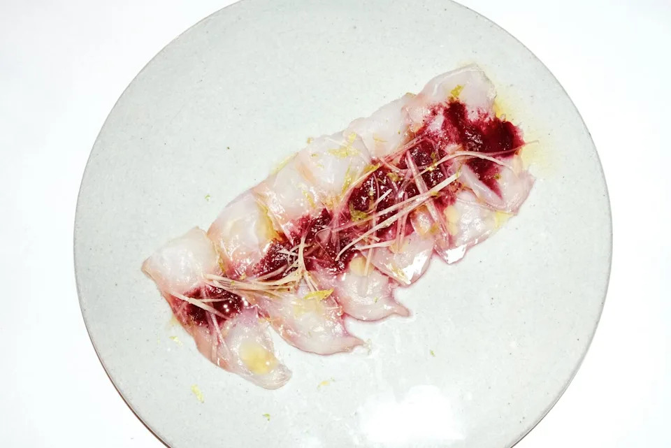 Slices of raw fish with plum and citrus at Little Fish in Melrose Hill.