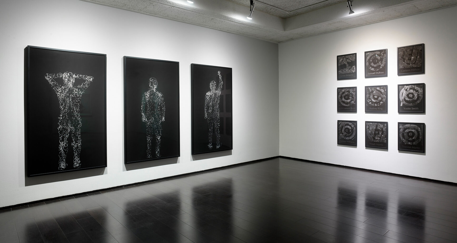 gallery with framed black and white photographs on walls