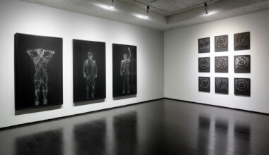 gallery with framed black and white photographs on walls