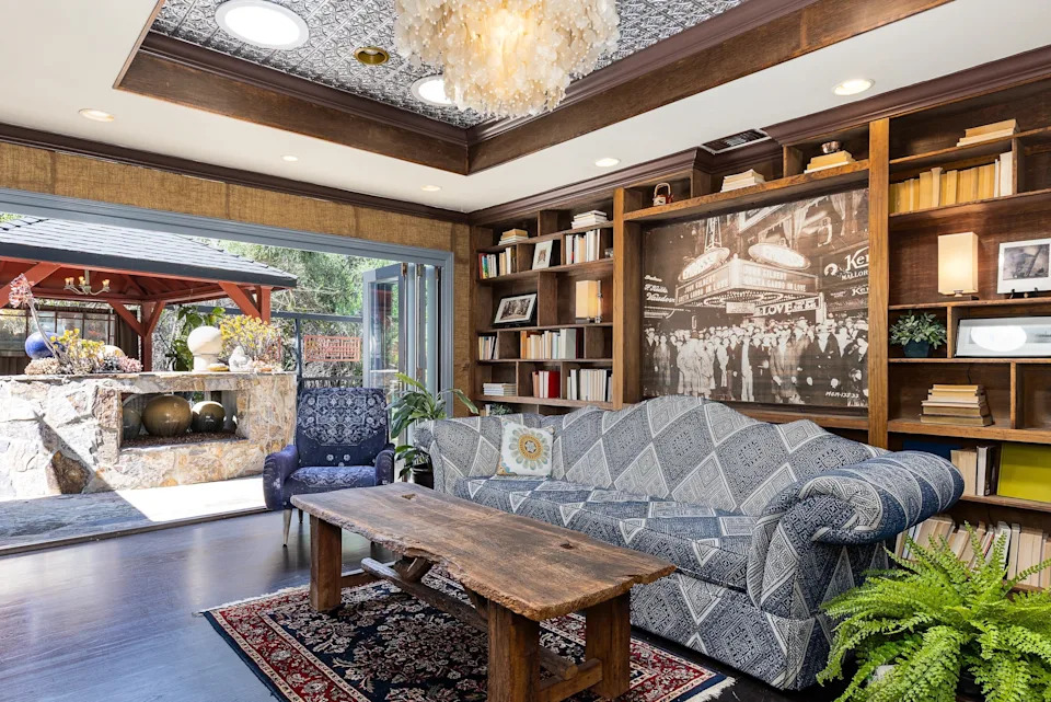 The shelves inside Farr's "library living room" feature two numbered art pieces that are built into the structure and serve as a nod to her career in show business.