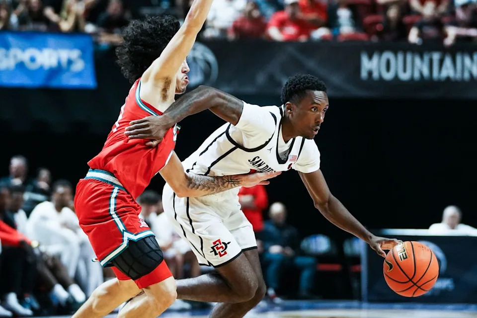 San Diego State BJ Davis (10) drives past New Mexico Uriah Tenette (4) during the semifinal Mountain West Championship tournament game between San Diego State and New Mexico on Friday March 13, 2026 in Las Vegas, Nev.