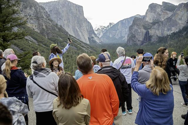 Crowds often form at popular places in U.S. national parks, like the entrance to Yosemite Valley in California.
