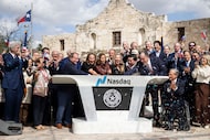 Officials celebrate while ringing the bell during the Nasdaq Texas Closing Bell Ceremony...