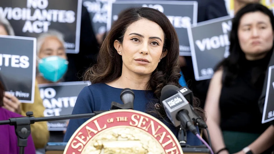 California State Sen. Sasha Renée Pérez speaking at a podium during a press conference at Pasadena City Hall.