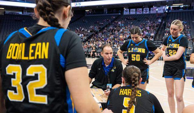 Faith Christian Lions coach Geoff Harris diagrams a play during a timeout against the Bret Harte Bullfrogs in the CiF Sac-Joaquin Section Division V girls basketball championship at Golden 1 Center on Saturday, Feb. 28. Harris stepped down after the 2025-26 season.