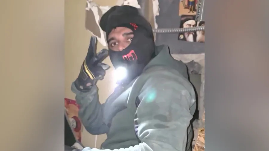 One of them even flashed a peace sign at the camera with a flashlight in his mouth while taking a break from smashing the wall with a crowbar. (IG/@venturacountyda)