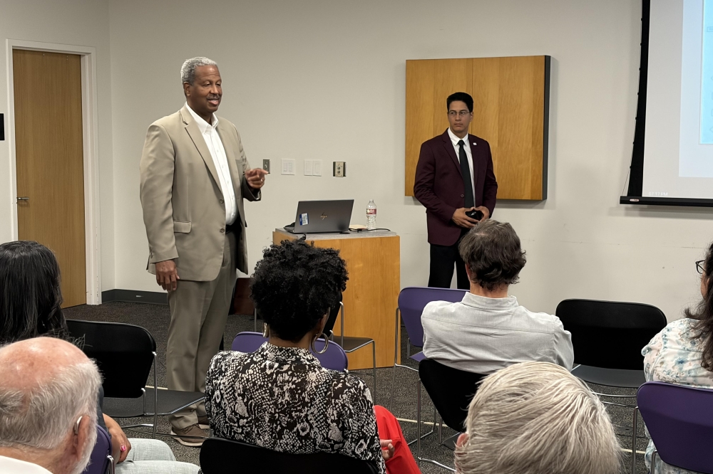 Fort Bend County Precinct 2 Commissioner Grady Prestage, left, answered some of residents' questions during the public meeting. (Brad Dountz/Community Impact)