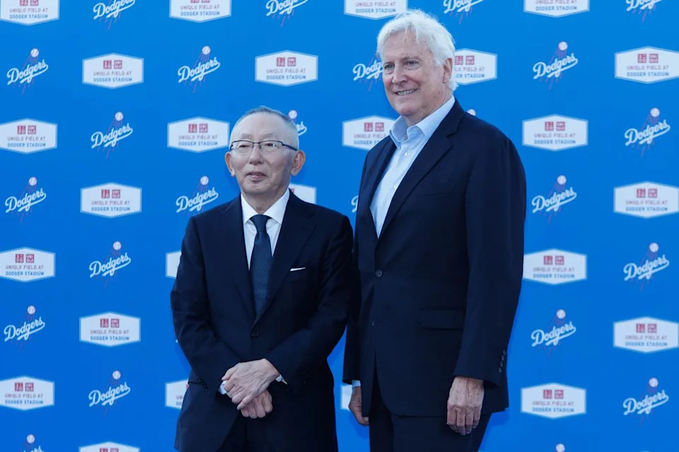UNQILO founder Tadashi Yanai and Los Angeles Dodgers chairman Mark Walter take a picture together during a UNIQLO partnership press conference on March 25, 2026 in Los Angeles, California.