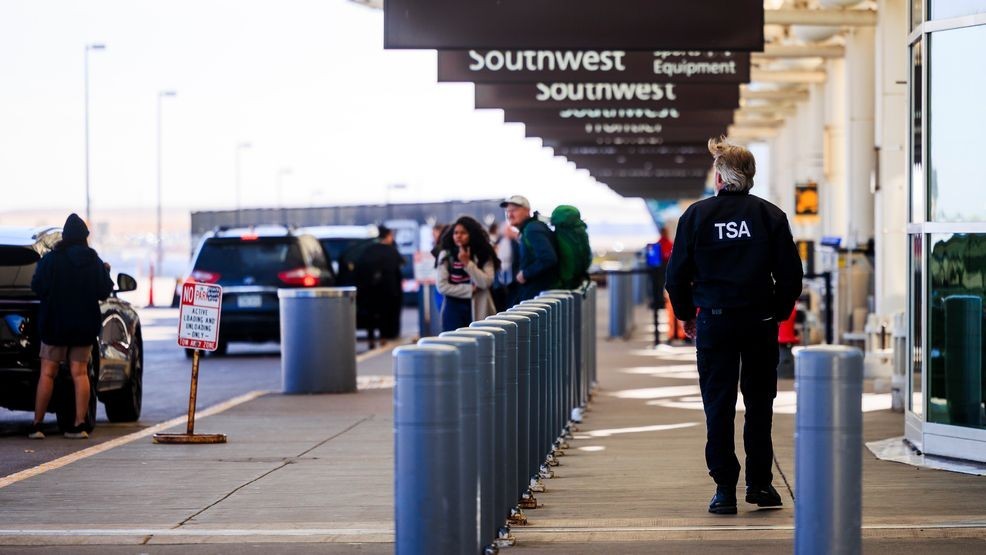 DENVER, COLORADO - NOVEMBER 8: A TSA agent walks outside the Denver International Airport on November 8, 2025 in Denver, Colorado. The FAA has targeted 40 "high-volume" airports, including Denver International Airport, for flight cuts amid the government shutdown. (Photo by Michael Ciaglo/Getty Images)