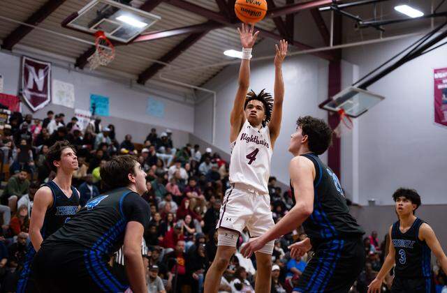 Natomas Nighthawks guard Manno Jenkins (4) makes a shot in the fourth quarter against the Priory Panthers in the CIF Northern California Division III boys basketball regional semifinal on Saturday.