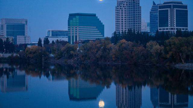The moon rises over the Sacramento skyline on Thursday, Dec. 4, 2025. The Sacramento County sheriff downplayed concerns on Thursday, March 12, 2026, of a potential Iranian drone attack on California after an unverified tip to the FBI made news.