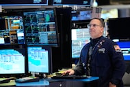 Anthony Matesic works on the floor at the New York Stock Exchange in New York, Thursday,...