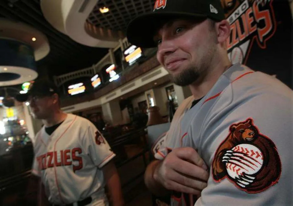 Derek Franks, right, then director of inside sales, helped show off the Fresno Grizzlies’ new uniforms when they debuted in November 2007.
