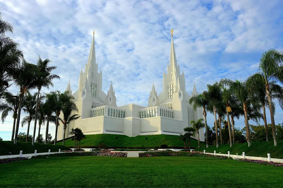 Lush, green gardens with an LDS Church temple in the background