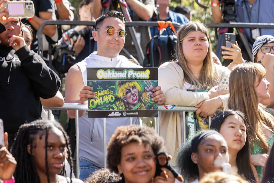 Fans hold signs during the Alysa Liu Celebration Rally at Frank Ogawa Plaza in front of Oakland City Hall in Oakland, Calif., on March 12, 2026. (Douglas Zimmerman/SFGATE)