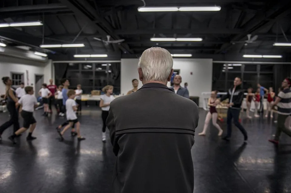 Sacramento Ballet Artistic Director Ron Cunningham works with children and professional dancers during a 2017 rehearsal of his final “Nutcracker” production.