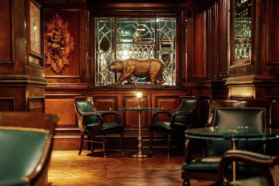 Designer Ken Fulk preserved original details from the Big Four, such as wall sconces made of rams' horns, carved wooden columns and mirrors etched with names of the four magnates. (Stephen Lam/S.F. Chronicle)