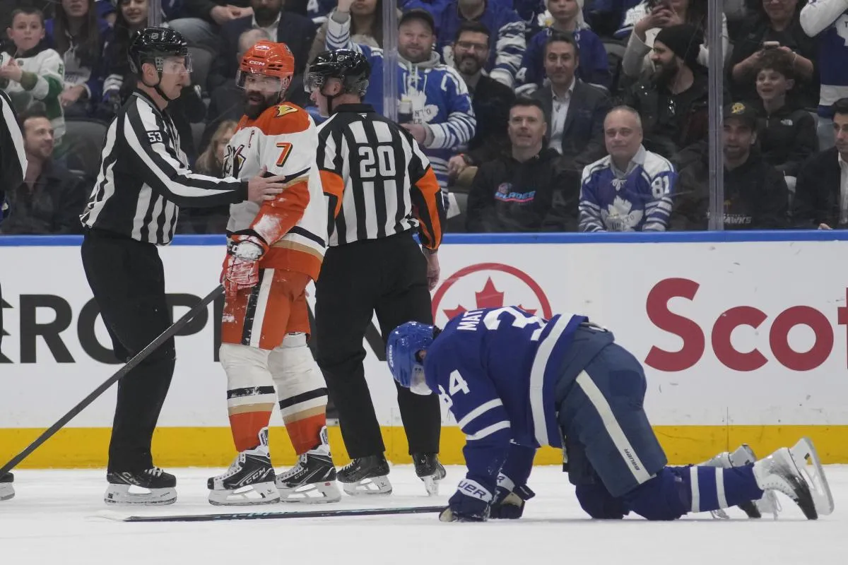 Anaheim Ducks defenseman Radko Gudas (7) looks at an injured Toronto Maple Leafs forward Auston Matthews (34) after he delivered a knee on knee hit during the second period at Scotiabank Arena