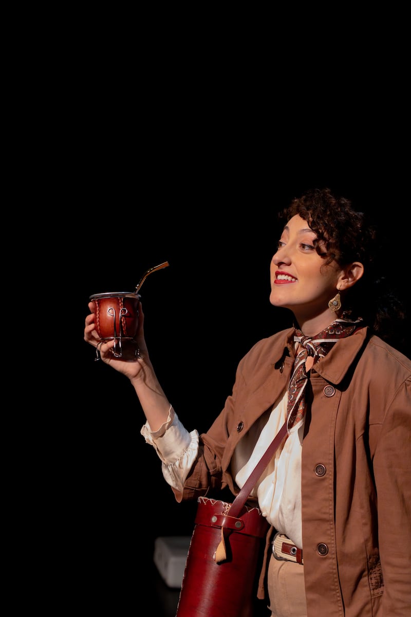 Natasha Nua is wearing a safari suit as she holds a gourd of mate, the national beverage of Argentina.
(Photo courtesy of Mel Skinder)