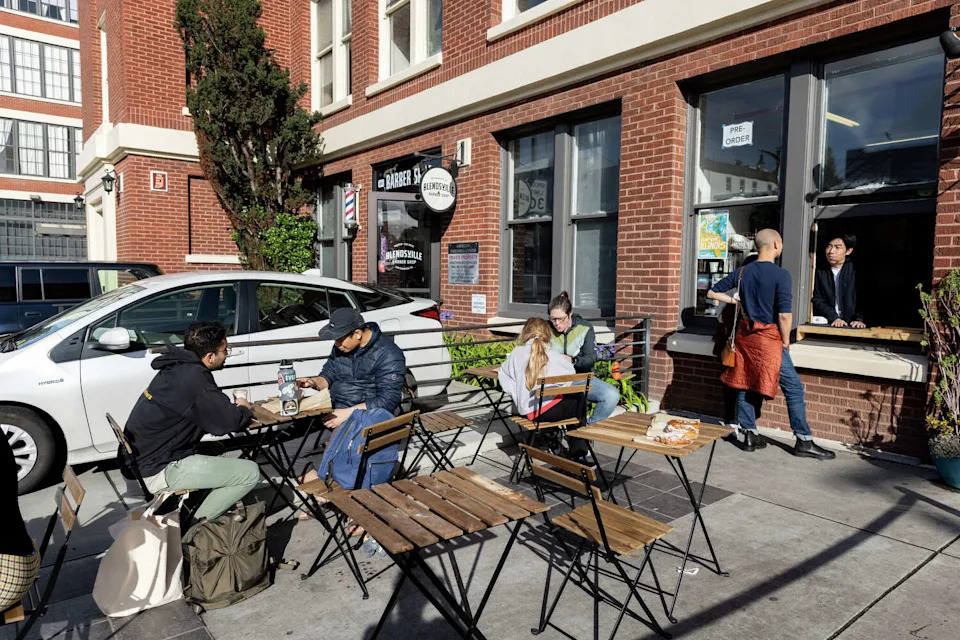 Patrons enjoy pastries from Neighbor Bakehouse and coffee from Paper Son Coffee's pop-up located in S.F.'s Dogpatch. January 14, 2024. (Lizzy Montana Myers/For the S.F. Chronicle)