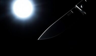 An extreme close-up of a shiny metal pocket knife blade, the harsh lighting and dark background creating a stark, gritty aesthetic that conceptually represents the violence of the stabbing incident.