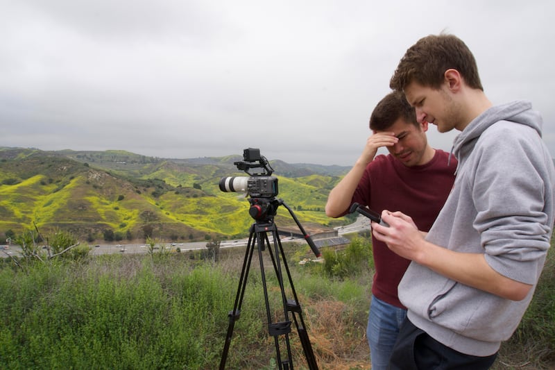 Ryan Grant (left) and Jan Hettich (right) are supervising and flying a drone to capture footage of the Wallis Annenberg Wildlife Crossing.
(Photo courtesy of Talia Frank)