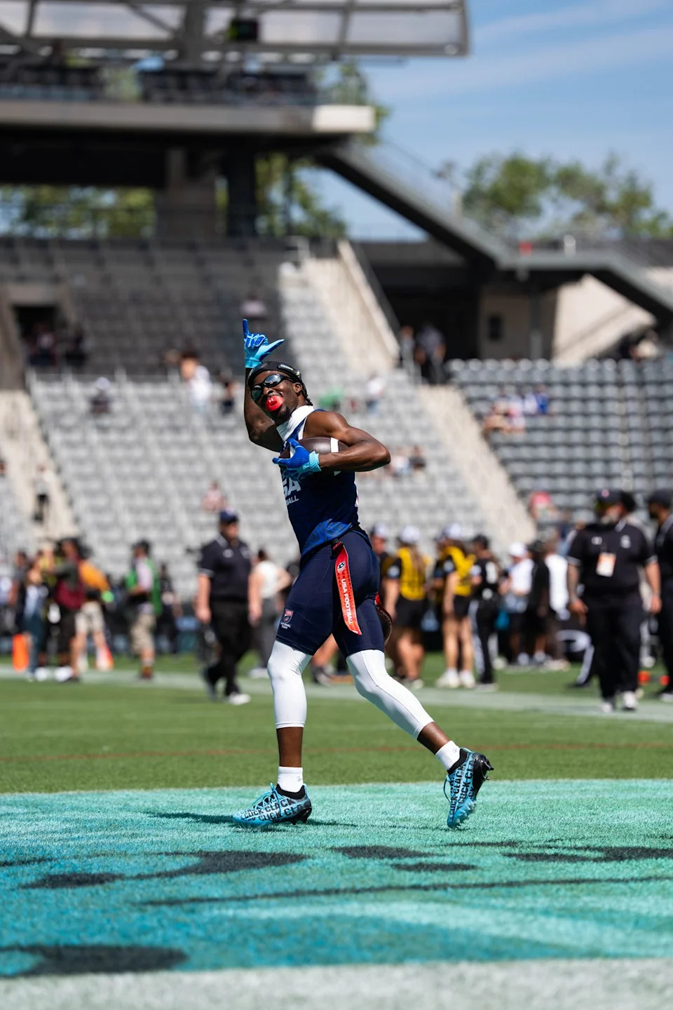 A Team USA player celebrates with fans during warmups ahead of the Fanatics Flag Football event, March 21, 2026, in Los Angeles.