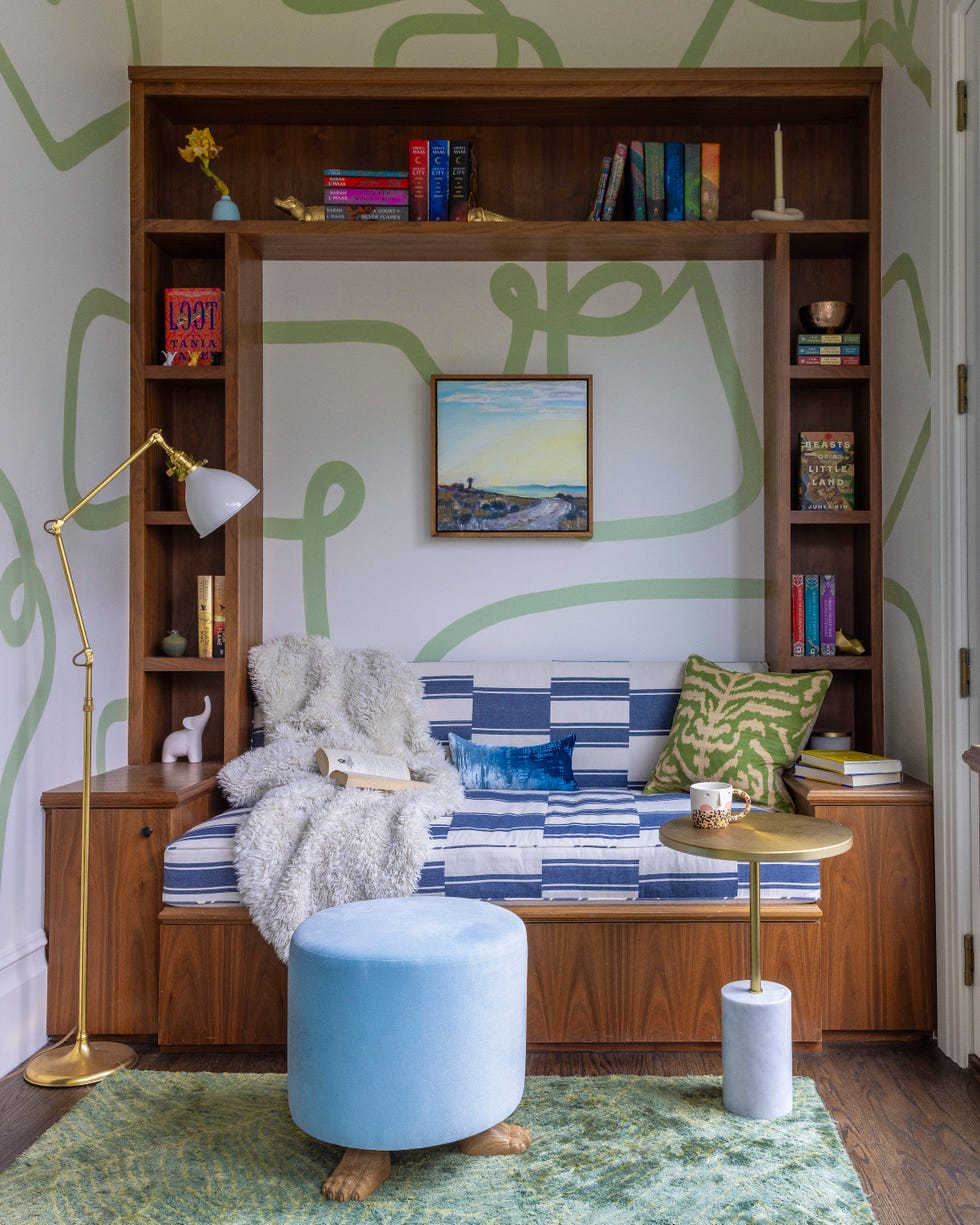 Cozy reading nook with bookshelves and decorative elements.