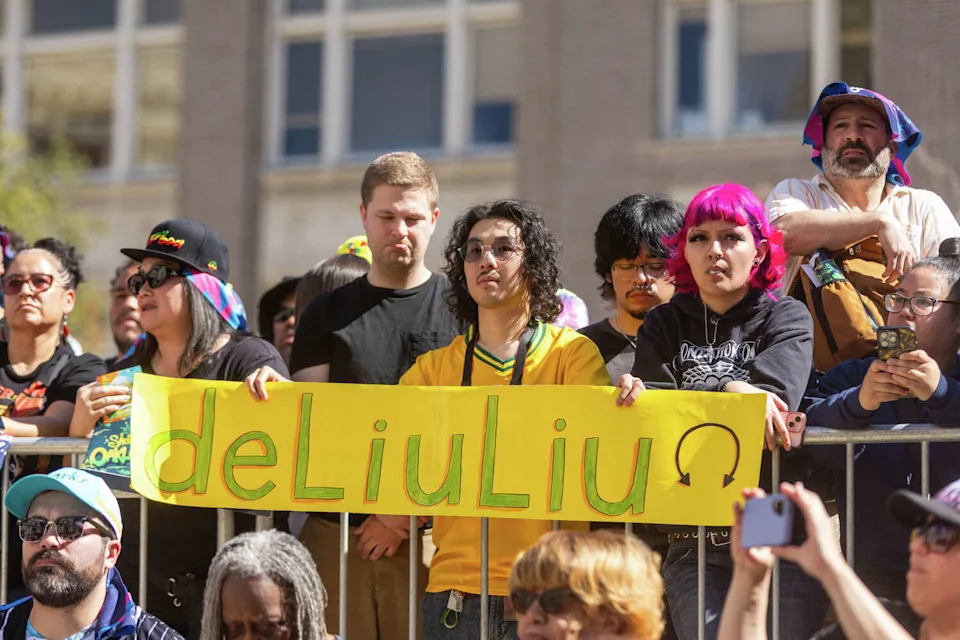 Fans hold signs honoring Olympic gold medalist Alysa Liu during the Alysa Liu Celebration Rally at Frank Ogawa Plaza in front of Oakland City Hall in Oakland, Calif., on March 12, 2026. (Douglas Zimmerman/SFGATE)