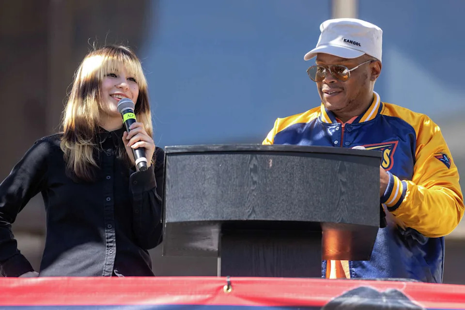 Alysa Liu (left) answers a question from MC Sway Calloway during the Alysa Liu Celebration Rally at Frank Ogawa Plaza in front of Oakland City Hall in Oakland, Calif., on March 12, 2026. (Douglas Zimmerman/SFGATE)
