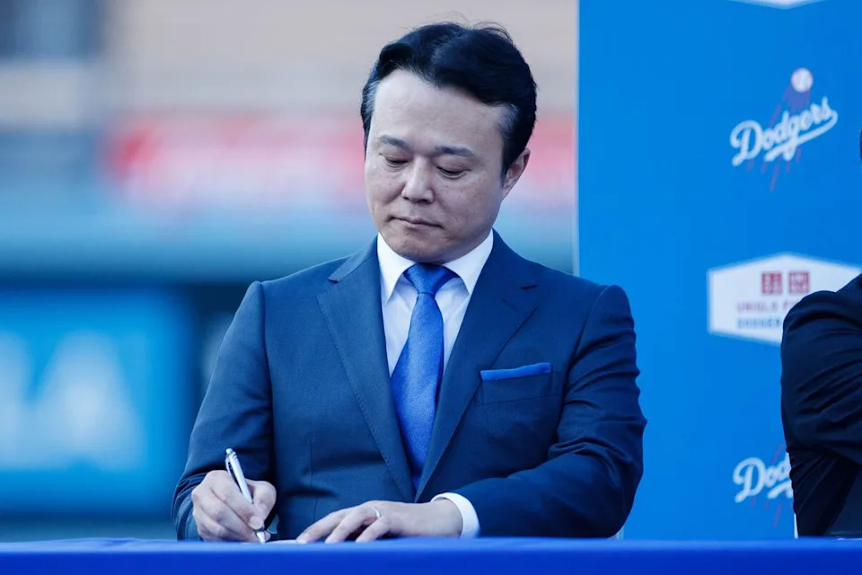 UNIQLO COO Daisuke Tsukagoshi takes notes during a UNIQLO partnership press conference on March 25, 2026 in Los Angeles, California.