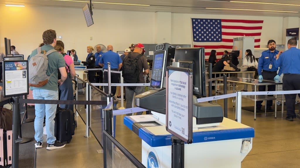People wait in line to clear TSA at Long Beach Airport. Rafael Fontoura for CA Post