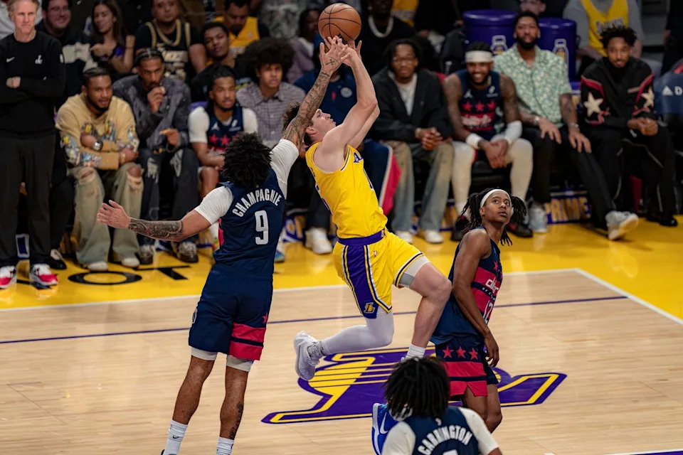 Los Angeles Lakers guard Austin Reaves (15) being fouled during an NBA basketball game against the Washington Wizards on March 30th, 2026 in Los Angeles, CA.