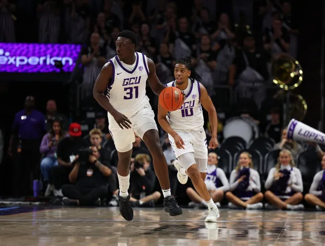 Dec 6, 2025; Phoenix, Arizona, USA; Grand Canyon University Antelopes forward Nana Owusu Anane (31) dribbles down court against the Oklahoma State Cowboys at PHX Arena.