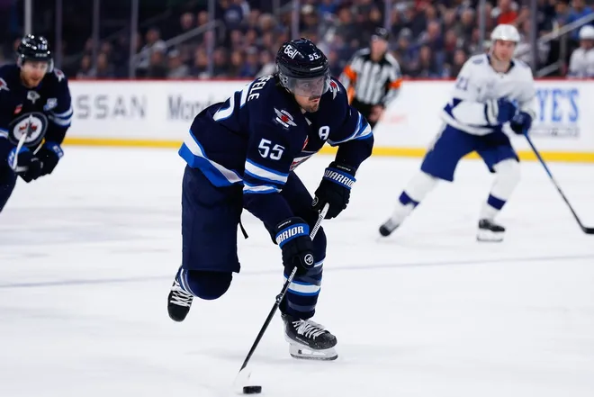Mar 5, 2026; Winnipeg, Manitoba, CAN; Winnipeg Jets forward Mark Scheifele (55) skates into the Tampa Bay Lightning zone during the second period at Canada Life Centre.