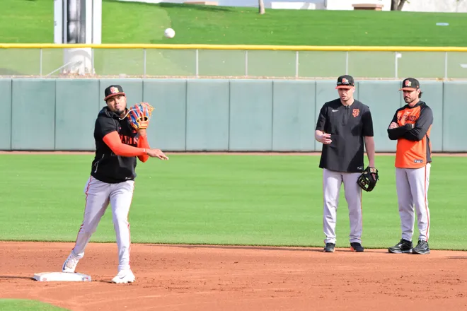 Feb. 18, 2026; Scottsdale, Arizona; San Francisco Giants manager Tony Vitello (right) watches his team during a Spring Training workout at Scottsdale Stadium.