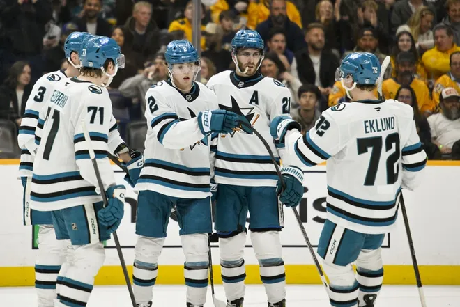 Mar 24, 2026; Nashville, Tennessee, USA; San Jose Sharks center Will Smith (2) celebrates with his teammates after scoring a goal against the Nashville Predators during the second period at Bridgestone Arena.