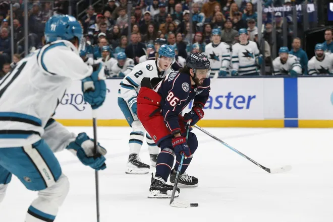 Mar 28, 2026; Columbus, Ohio, USA; Columbus Blue Jackets right wing Kirill Marchenko (86) skates with the puck as San Jose Sharks center Will Smith (2) trails the play during the first period at Nationwide Arena.