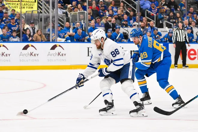 Mar 28, 2026; St. Louis, Missouri, USA; Toronto Maple Leafs right wing William Nylander (88) controls the puck as St. Louis Blues left wing Pavel Buchnevich (89) defends during the third period at Enterprise Center.